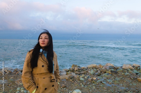 Obraz Dramatic portrait of a girl by the sea in winter
