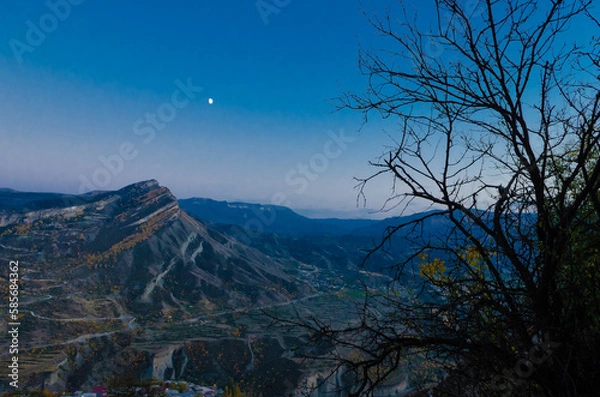 Obraz Night view of a village in the Caucasus mountains.