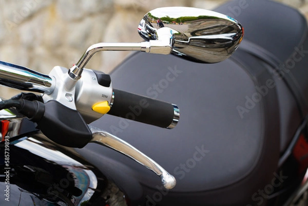 Obraz Close-up view of motorcycle handle with switches and mirror