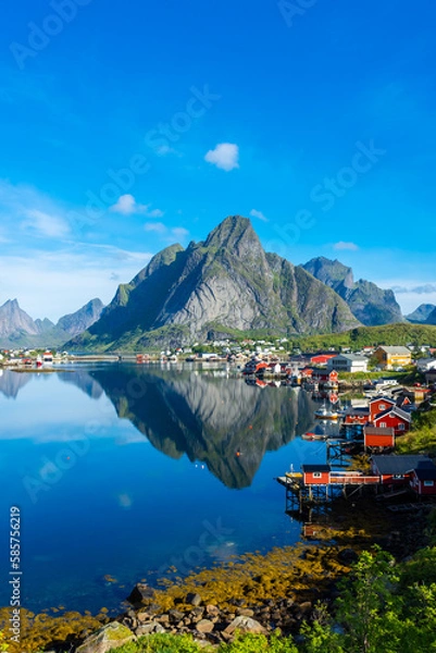 Fototapeta Perfect reflection of the Reine village on the water of the fjord in the Lofoten Islands,  Norway