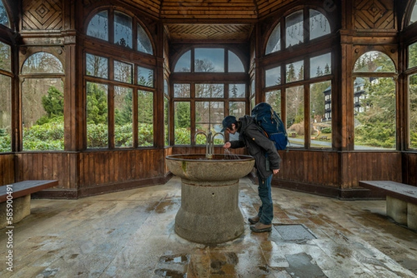 Fototapeta Healthy spring with old nice shelter with window in Karlova Studanka spa town