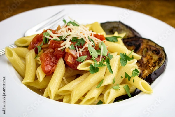 Obraz A freshly prepared dish of Pasta alla Norma.