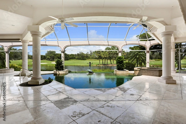 Fototapeta Luxury Lanai Pool with View of Golf Course in Gated Community in Naples, Florida Featuring Beautiful Landscaping