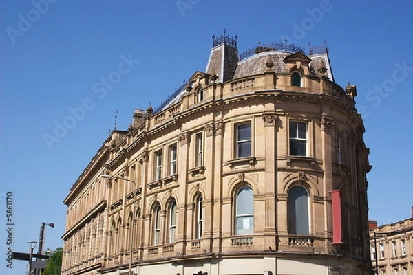 Obraz building against a blue sky
