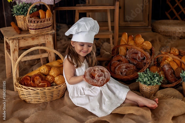 Obraz the cook girl holds a pie with nuts in her hands
