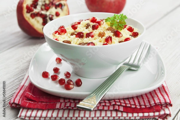 Obraz Couscous with pomegranate, raisins and spices