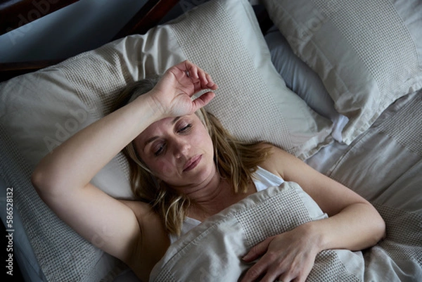 Obraz Menopausal Mature Woman Suffering With Insomnia In Bed At Home
