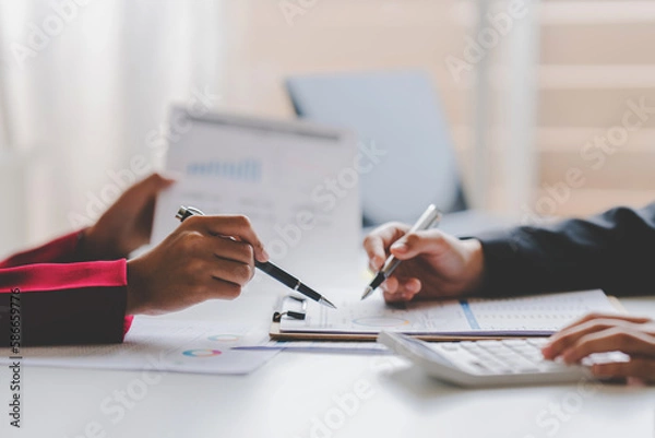 Fototapeta Businessman, financial inspector and secretary doing calculations make account analysis report Real estate investment information, financial and tax system concept