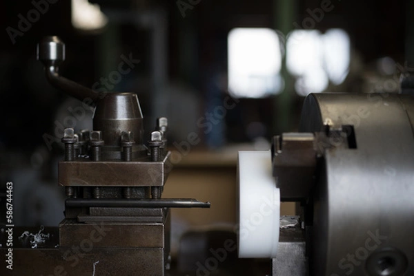 Obraz Work that cuts resin material with a lathe
