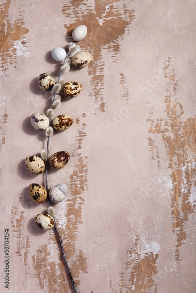 Fototapeta Table Easter decor set with quail eggs and willow branch on wooden vintage table.