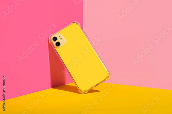 Obraz Yellow iPhone 11 and 14 Plus in clear phone case, bright and colorful phone case mock up 