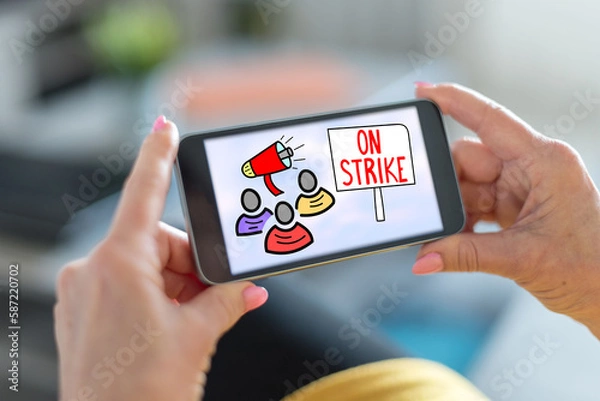 Fototapeta On strike concept on a smartphone
