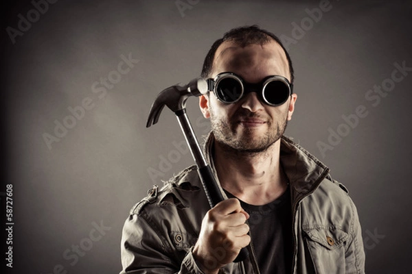 Obraz portrait of the mad miner with a hammer in hand