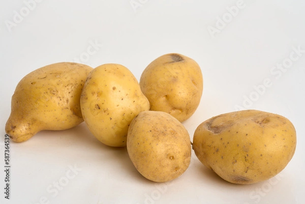 Fototapeta yellow potatoes isolated on white 