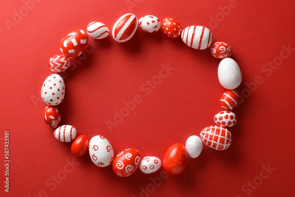 Fototapeta Easter backgrounds with a frame of Easter red and white eggs on a bright red background