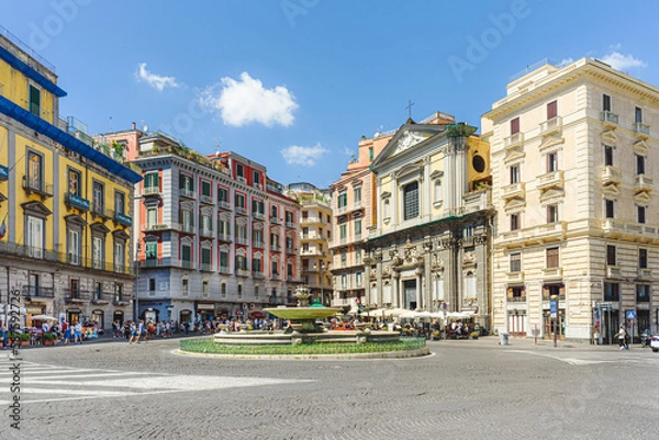 Obraz Naples, Italy. View of Piazza Trieste e Trento on a sunny August day. In the foreground, the so-called Artichoke Fountain. On the background the San Ferdinando Curch. 2022-08-20.