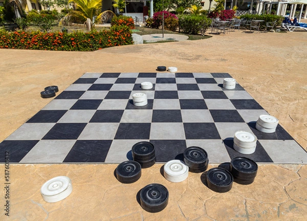Fototapeta Checkers game, black and white pieces. Game for intelligenc and strategy.