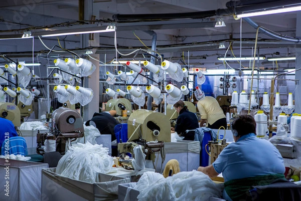 Obraz production of capron tights. Textile factory with machines and equipment for production of women's stockings and capron tights.