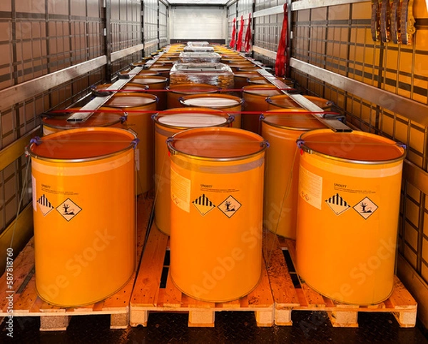 Fototapeta Loading, transportation and unloading of barrels with hazard class 9 in a semi-trailer. Transportation of dangerous goods by ADR cargo transport