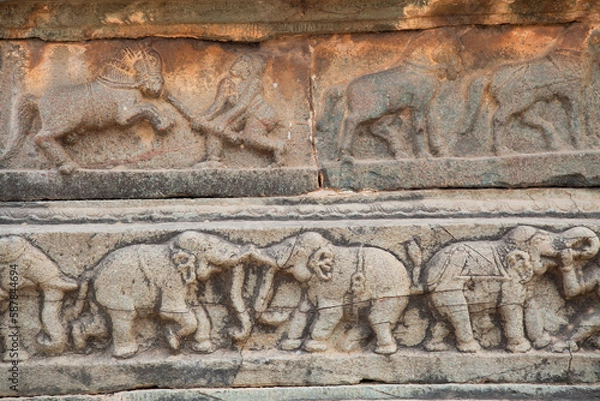 Fototapeta Medieval stone wall carvings of animals from ancient architecture ruins at the royal enclosure at Hampi, Karnataka India