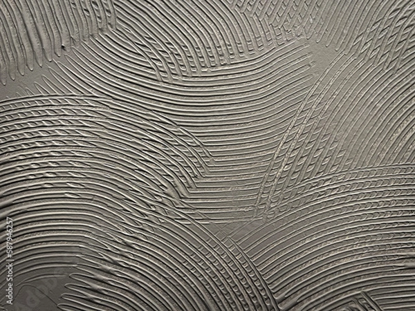 Fototapeta Gray wall glue plaster comb surface prepared for tiling. Tile adhesive notched trowel patterns. Adhesive background. Cement wall