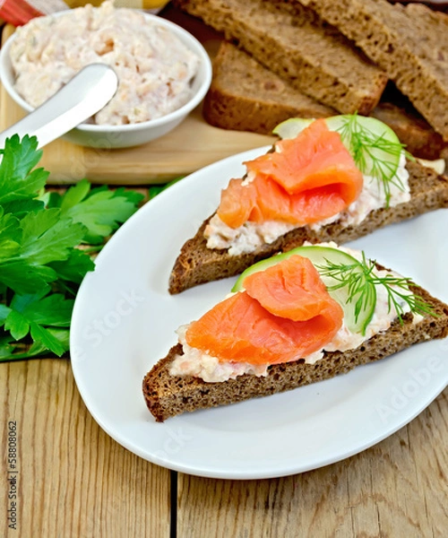 Fototapeta Sandwich with cream and salmon in the dish with dill