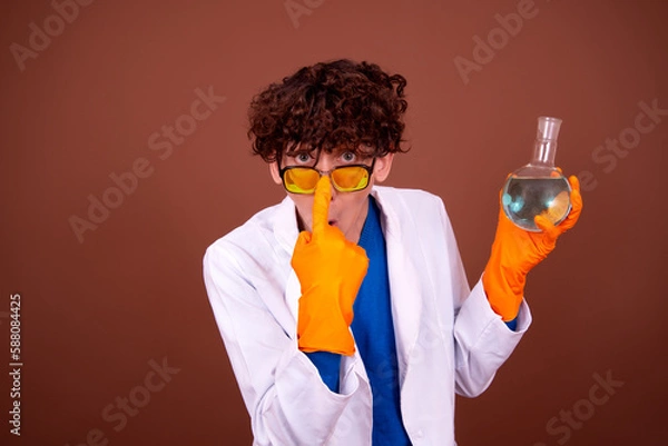 Obraz Crazy young scientist makes experiments in the office.