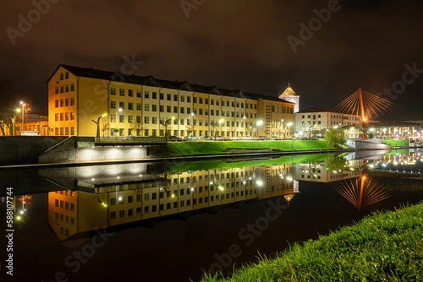 Fototapeta Large building near the river in the night