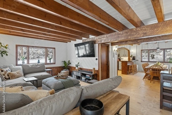 Fototapeta Modern living room with a comfortable couch and rustic elements