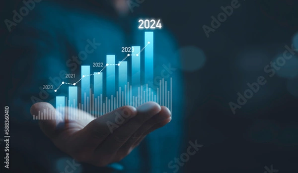 Obraz Businessman holding glowing virtual technical graph and chart for analysis stock market in 2024, technology investment and value investment concept.