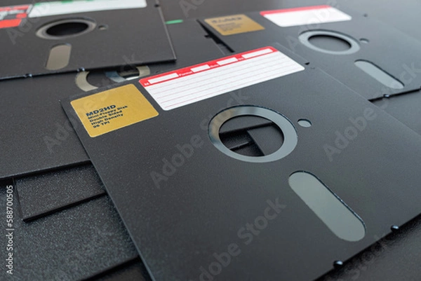 Obraz 5.25 inch floppy disks for  technology vintage background. Old diskettes on the table.
