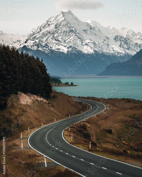 Fototapeta Scenic winding road along Lake Pukaki to Mount Cook National Park, South Island, New Zealand during cold and windy winter morning. One of the most beautiful viewing point of Aoraki Mount Cook.