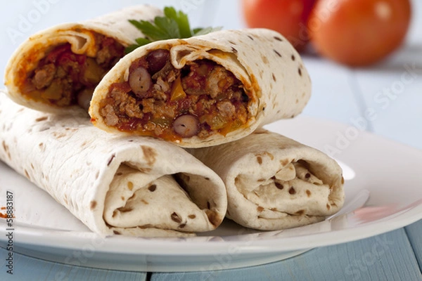 Fototapeta burritos wraps with meat beans and vegetables