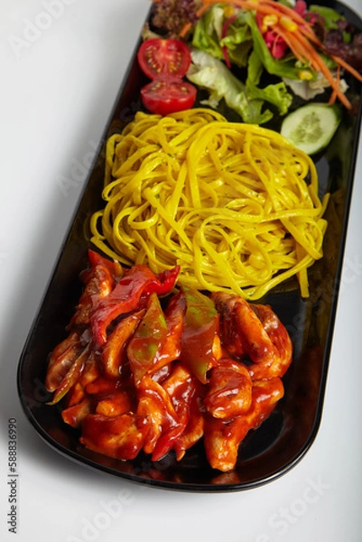 Obraz Grilled Chicken Linguine Pasta with Hot Sauce and Green Salad White Background