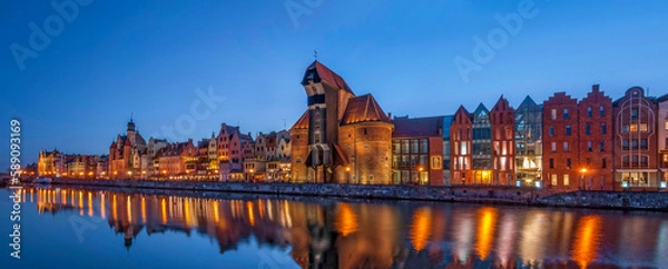 Fototapeta The view at the medieval port crane, called Zuraw, over the river Motlawa. Gdansk, Pomeranian Voivodeship, Poland.