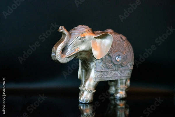 Obraz elephant figurine isolated on a black background