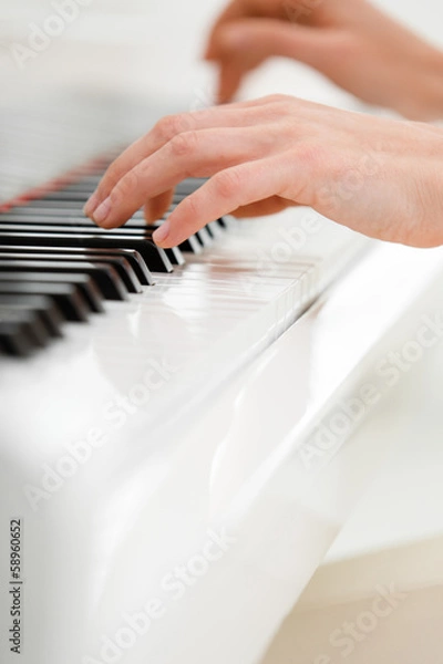 Fototapeta Close up view of hands playing piano
