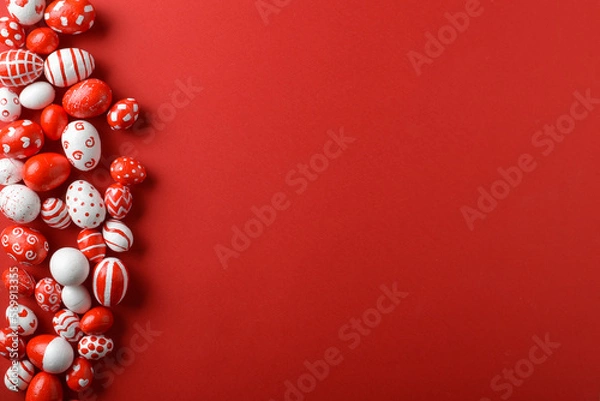 Fototapeta Easter backgrounds, scattered Easter red and white eggs on a bright red background