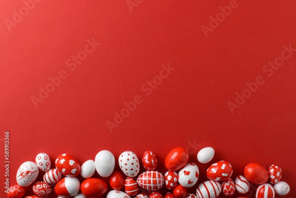 Fototapeta Easter backgrounds, scattered Easter red and white eggs on a bright red background