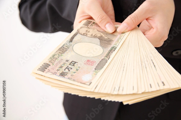 Obraz お金を広げて持つ人