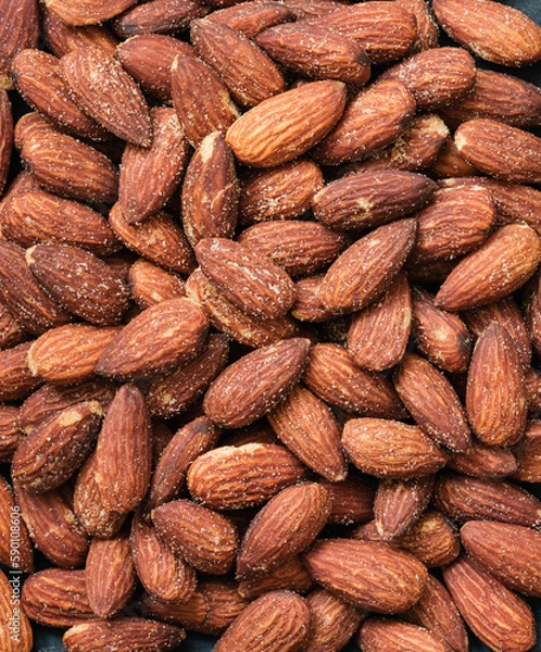 Obraz Roasted salted almonds.