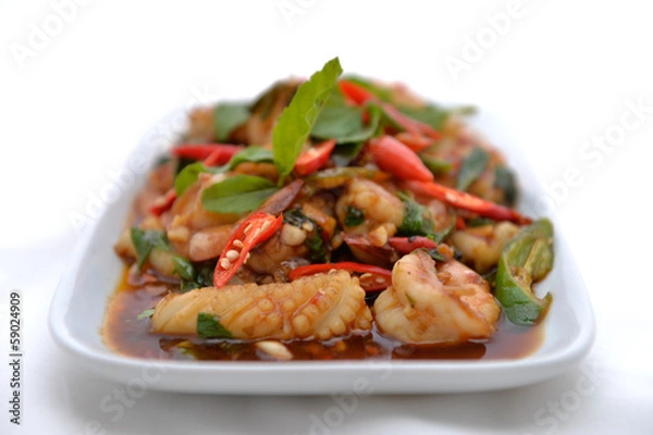 Fototapeta Thai fried shrimp and squid in basil sauce