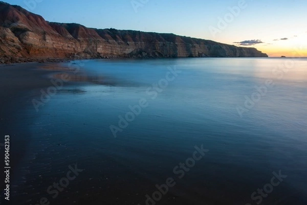 Fototapeta Shore and the calm ocean during scenic sunset, Port Willunga, Australia
