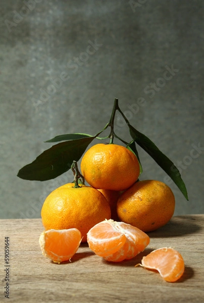 Obraz Still life with orange fruites on wooden table
