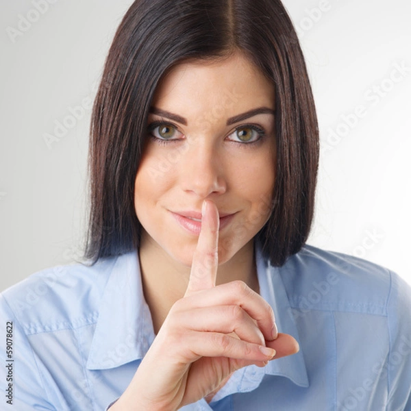 Obraz Woman making a shushing gesture