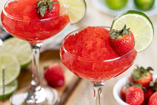 Fototapeta Frozen strawberry daiquiri cocktail with strawberries and lime