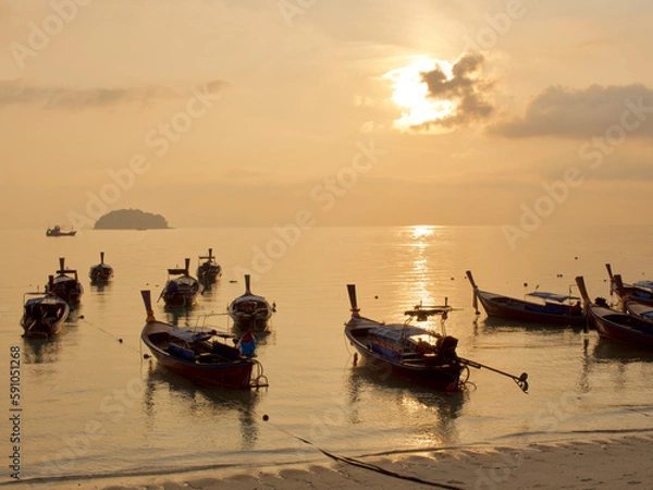 Fototapeta Small scale fisheries boat with sunset sky in Thailand 