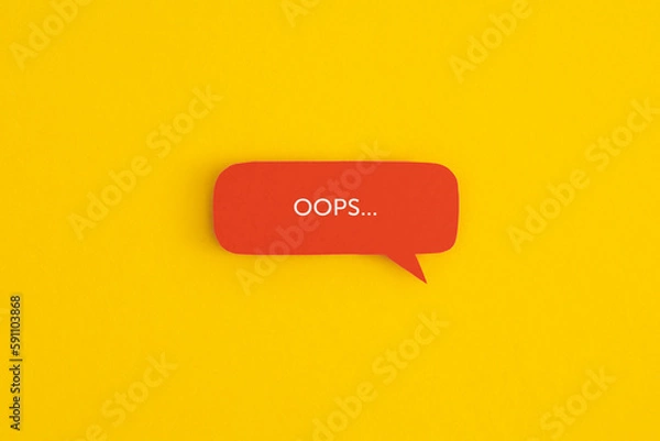 Fototapeta Paper speech bubble with the word "OOPS" on a yellow background. Top view with copy space. Flat lay.