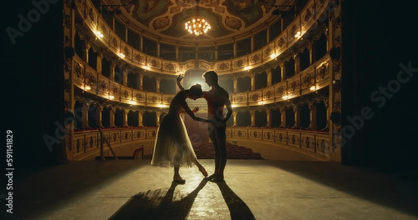 Obraz Cinematic shot of Young Couple of Classical Ballet Dancers Performing on the Stage of Classic Theatre with Dramatic Lighting. Male and Female Dancers Rehearse their Performance Together Before a show