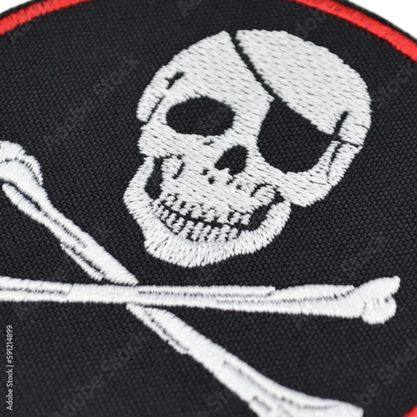 Fototapeta Embroidered patch depicting a skeleton, skull, death. Accessory for metalheads, punks, rockers, bikers, satanists, emo, street aggressive subcultures. Pirates style.